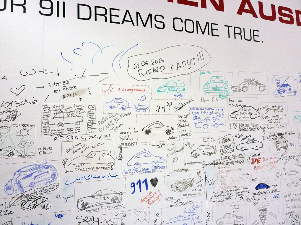 Visitor signatures detail in the Porsche Museum