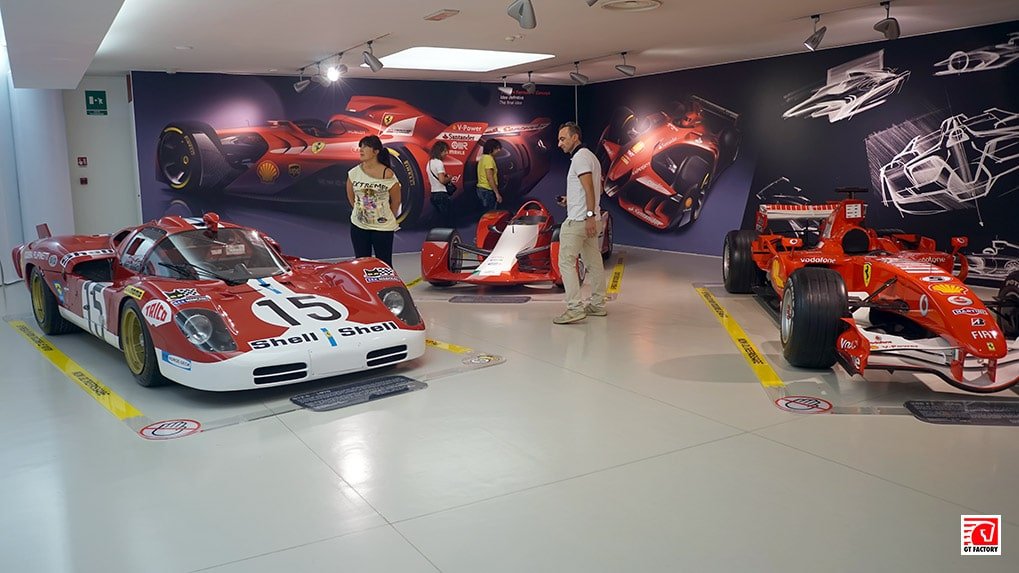 Ferrari race car concept displayed alongside historic and modern racing cars