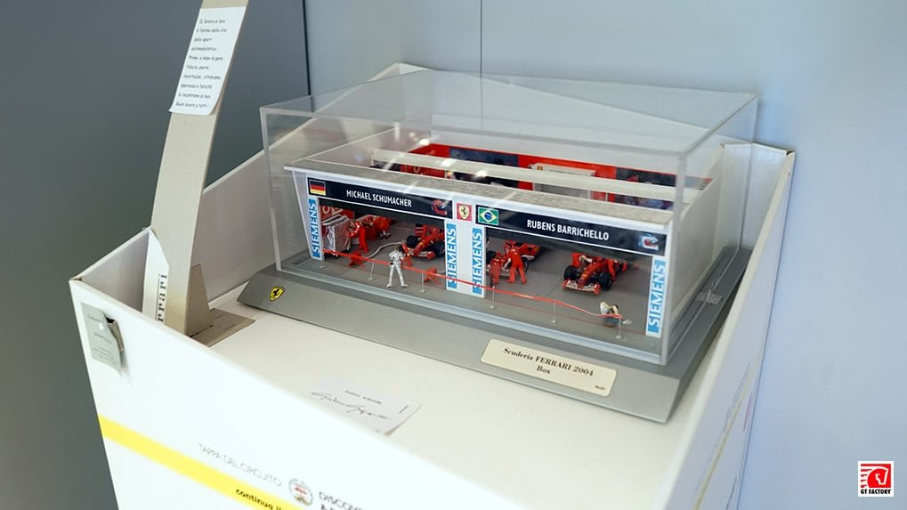 Scuderia Ferrari Grand Prix paddock model display in the museum lobby