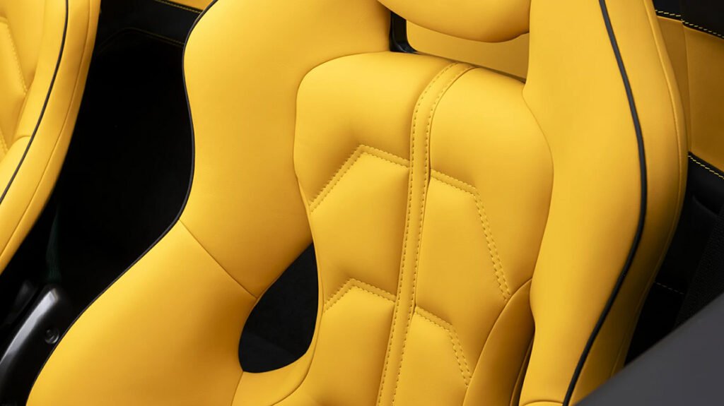 Bespoke Ferrari interior upholstery with yellow leather and contrast detailing