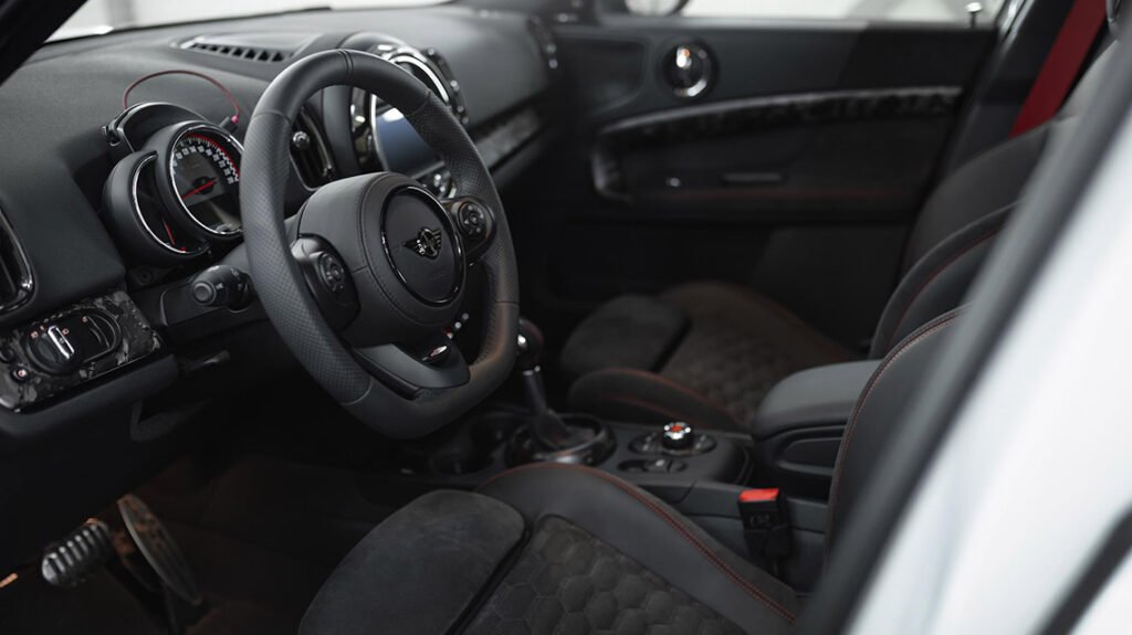 Custom MINI F60 JCW interior with black upholstery and red accents