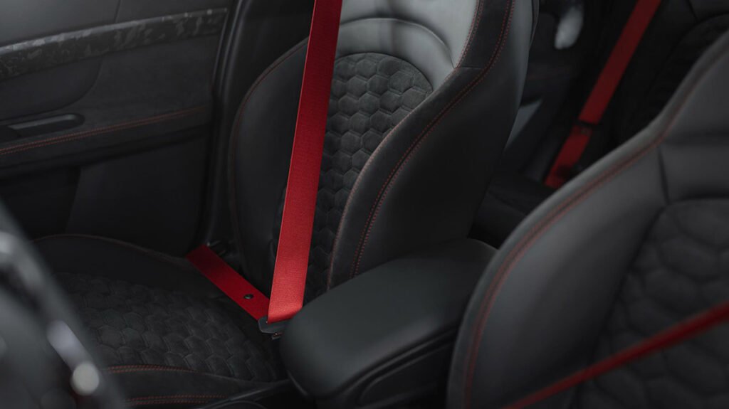 MINI F60 JCW rear seats with black upholstery and red seat belts