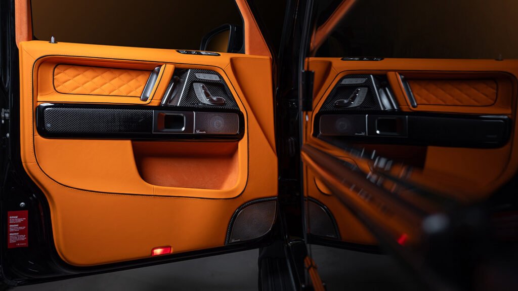 Mercedes-Benz G63 door panel with Lava Orange leather and gloss carbon trim