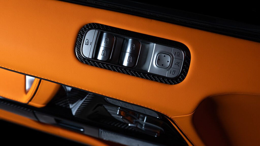 Mercedes-Benz G63 door controls with Lava Orange leather and carbon trim