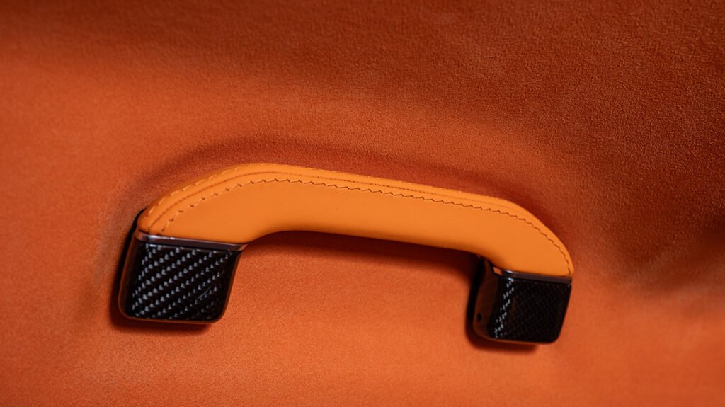 Mercedes-Benz G63 Lava Orange interior handle with carbon fiber detail