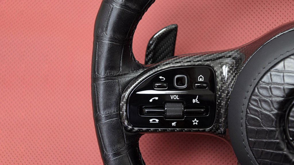 Mercedes-AMG G63 steering wheel control area with alligator leather and carbon fiber