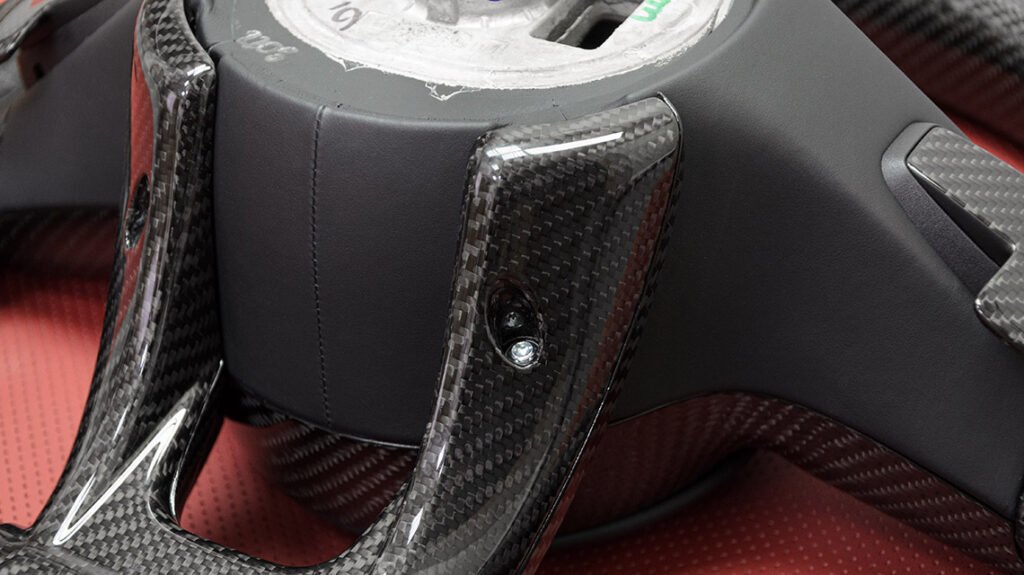 Carbon fiber rear spoke detail on Mercedes-AMG G63 signature steering wheel