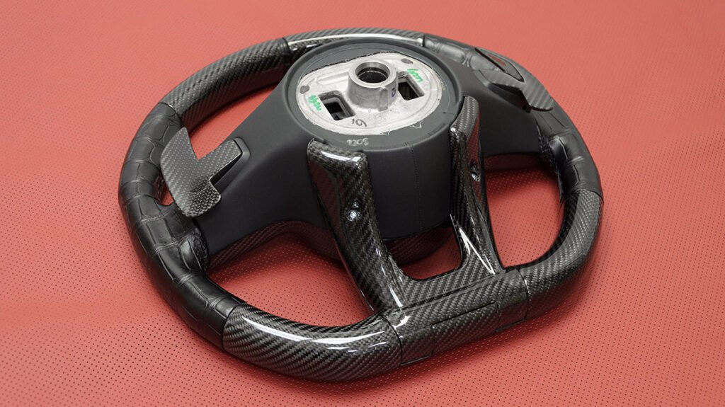 Rear view of Mercedes-AMG G63 signature steering wheel with carbon fiber and paddle shifters
