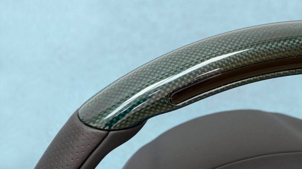 Close-up of green carbon fiber top section on Ferrari 458 steering wheel