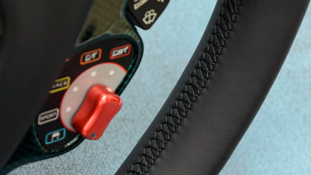 Close-up of Ferrari 458 steering wheel grip with black leather stitching