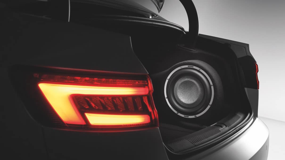 High-fidelity car audio subwoofer installation in premium vehicle trunk